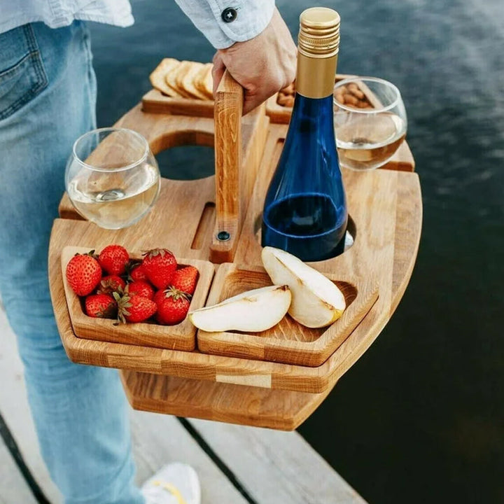 Rustic wooden snack tray and portable wine table for al fresco dining.