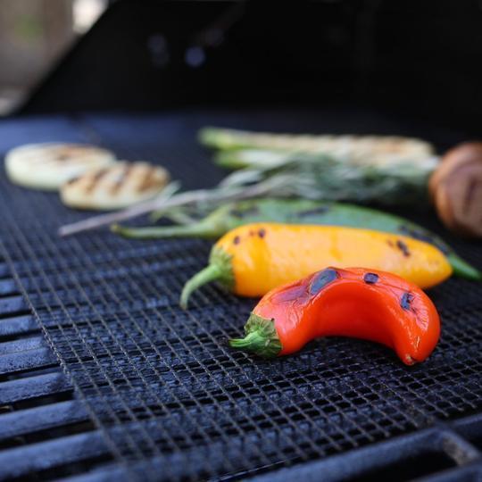 Easy clean grill mat, reusable and non-stick, perfect for healthy outdoor cooking and grilling.