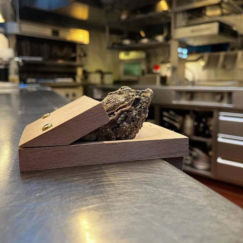 Effortless seafood oyster opener and shucker tool with robust blade for quick and safe shell opening in kitchen.
