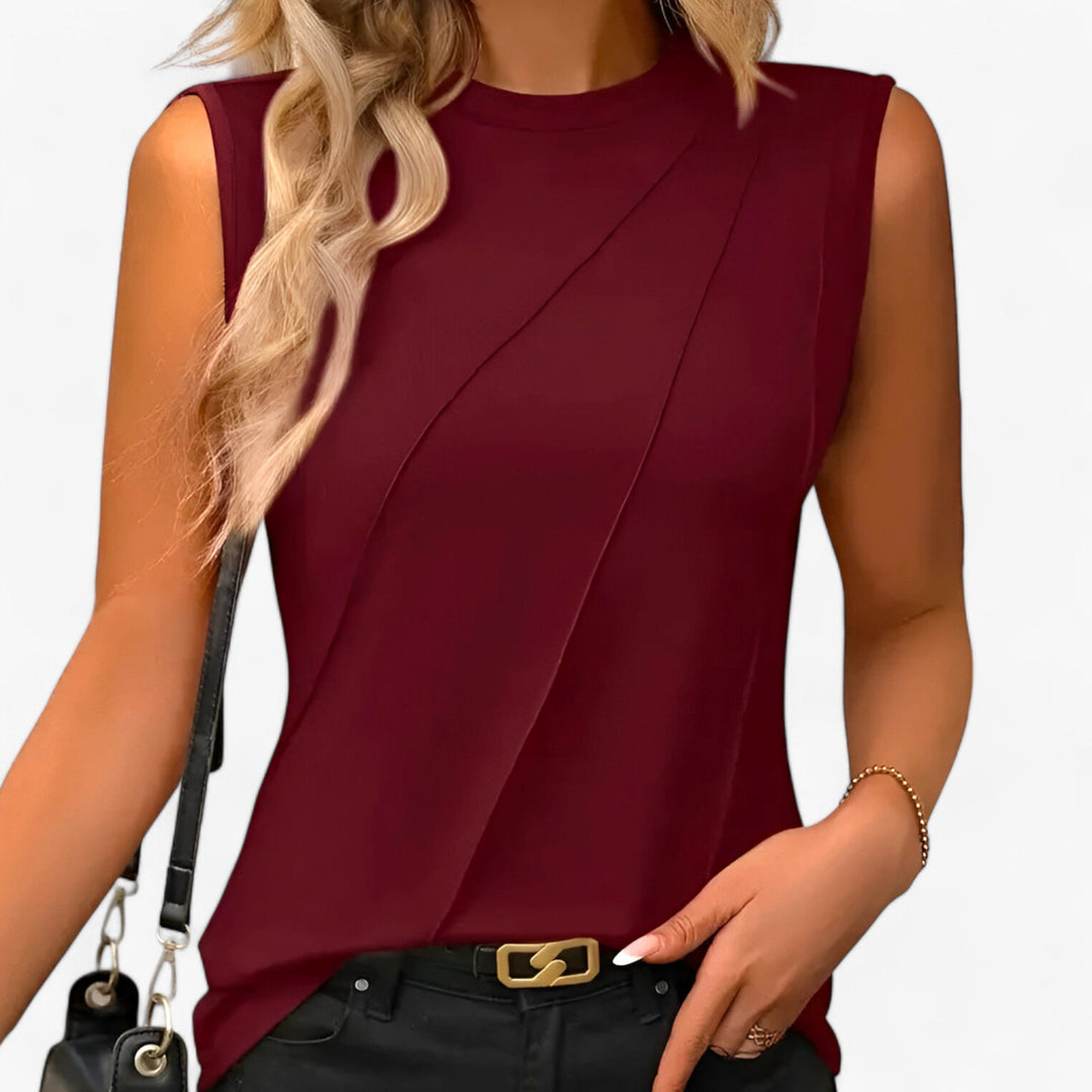 Modern women's sleeveless fitted top with a crew neck, perfect for office or casual summer outfits.
