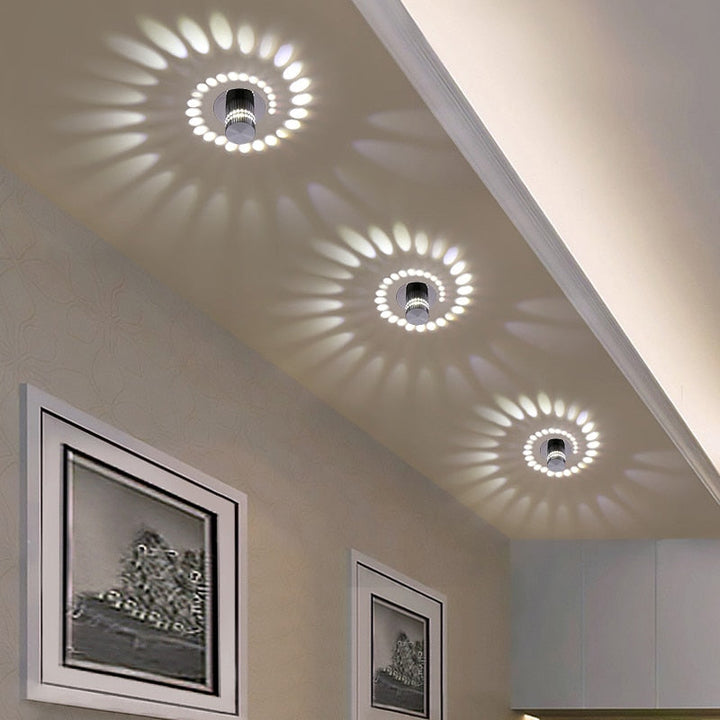 Modern spiral LED wall/ceiling light, aluminum. Energy-saving ambient glow for contemporary home decor.
