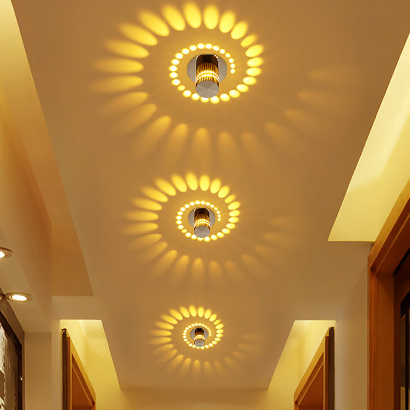 Sleek aluminum spiral LED light. Modern wall/ceiling lamp, energy-saving ambient glow for contemporary decor.