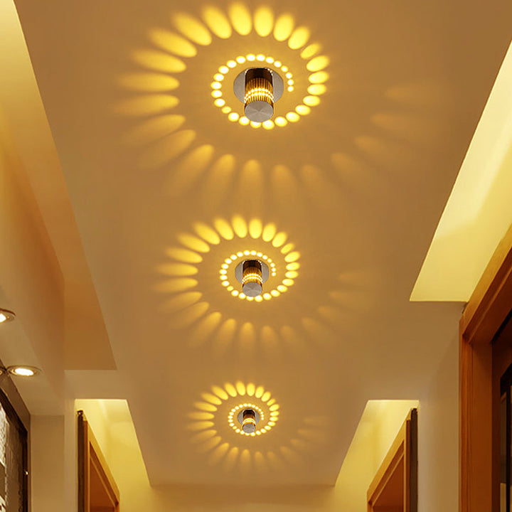 Sleek aluminum spiral LED light. Modern wall/ceiling lamp, energy-saving ambient glow for contemporary decor.