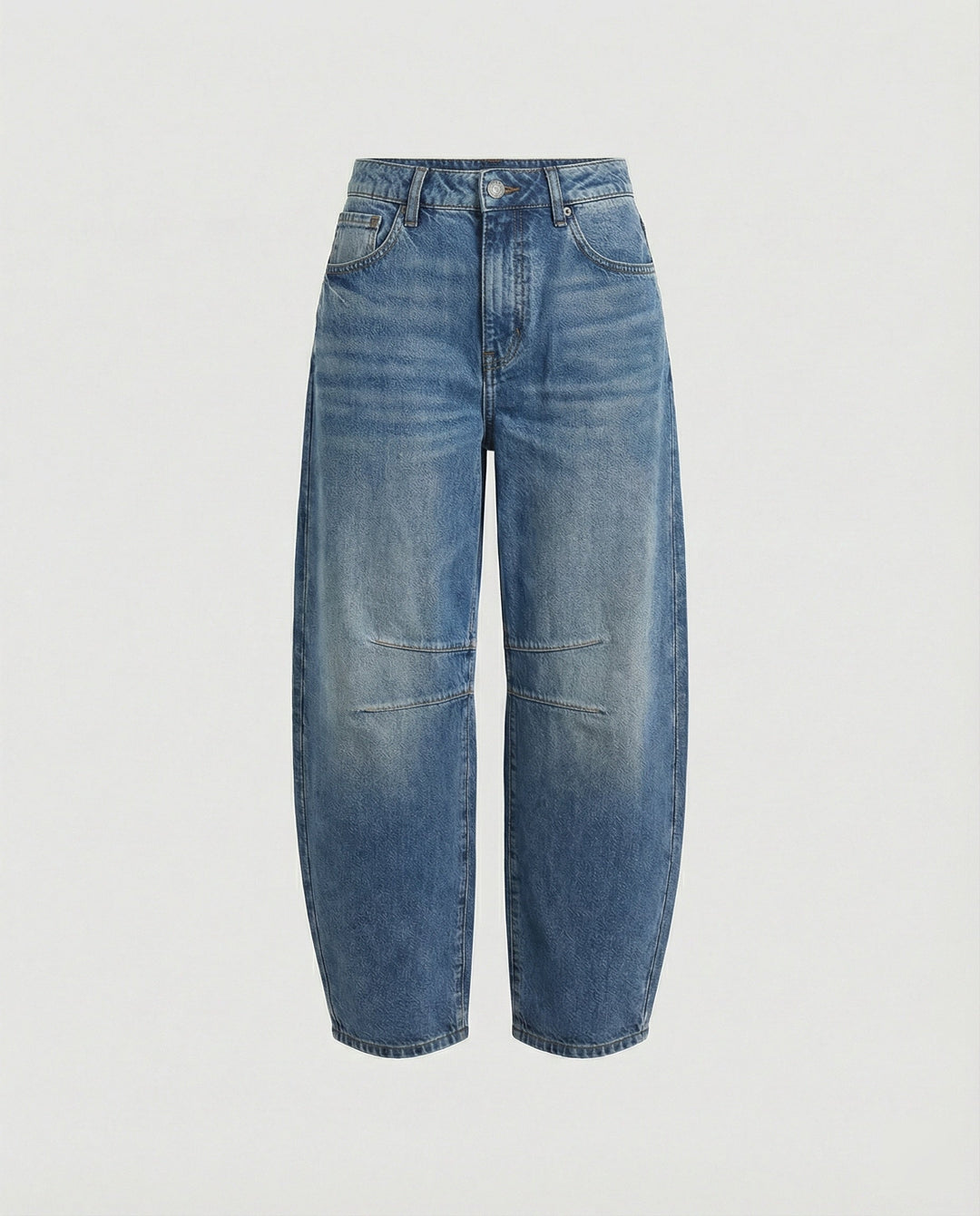 Trendy women's barrel jeans with a mid-rise waist and relaxed, curved leg fit for casual wear.