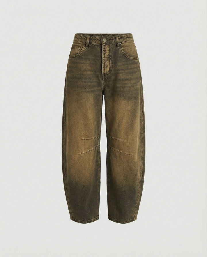 Stylish women's mid-rise barrel fit denim jeans, offering a relaxed and trendy curved leg silhouette.