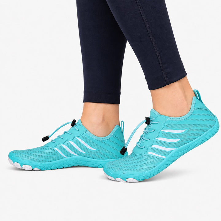 Women's athletic barefoot shoes, quick lace system for secure fit, flexible sole.