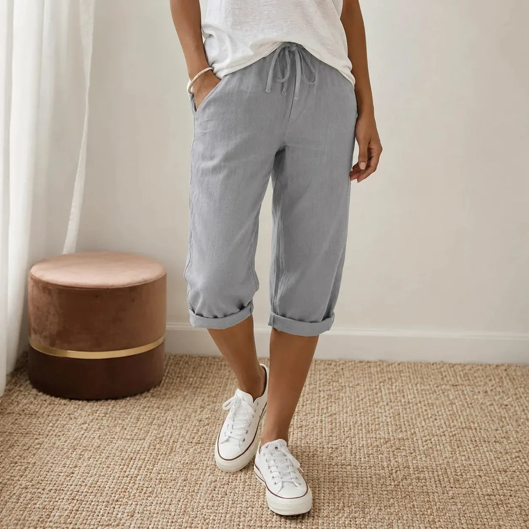Effortless women's pull-on capri pants, elastic waist for easy wear, stylish folded cuff.