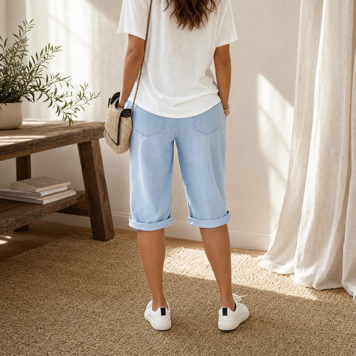 Women's comfortable pull-on capri pants featuring an elastic waist & stylish folded cuff.