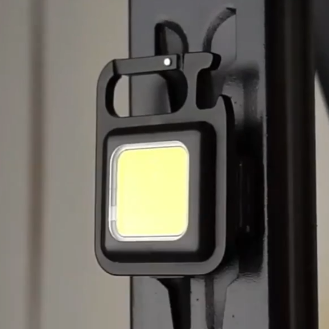 Mini rechargeable COB LED flashlight. Essential everyday carry multi-tool with bottle opener function.