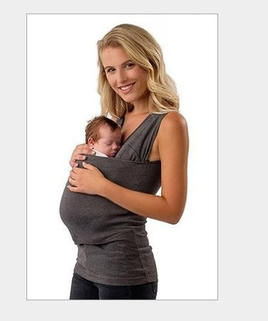Active parent wearing a black unisex babywearing T-shirt, securely carrying an infant for hands-free movement.