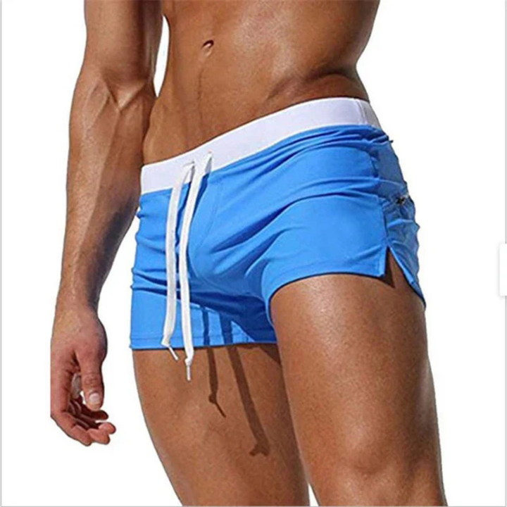 Versatile men's quick-drying swim shorts with drawstring, suitable for swimming, beach, and casual summer wear.