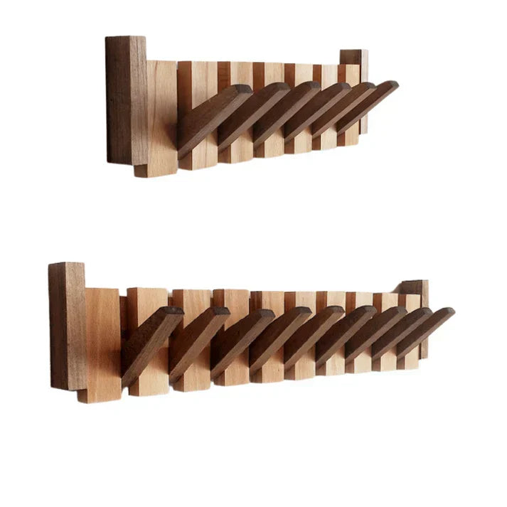 Piano-style wall-mounted coat rack featuring decorative keys. Unique wood hook entryway organizer & modern decor.