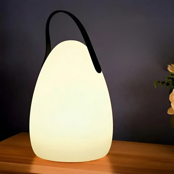 Sleek RadianceFlex modern LED table lamp, wireless, portable, and waterproof for contemporary indoor/outdoor spaces.