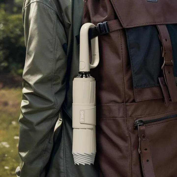 Unisex reflective umbrella, robust windproof design for effective rain and storm defense.