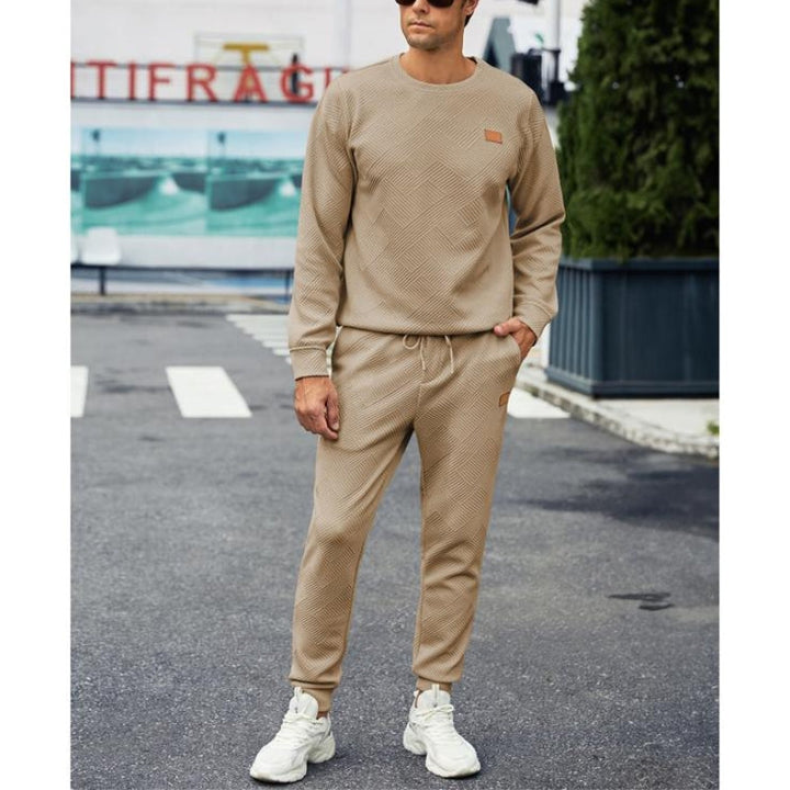 Close-up of the soft fabric on a men's 2-piece crew neck tracksuit set. High-quality loungewear.