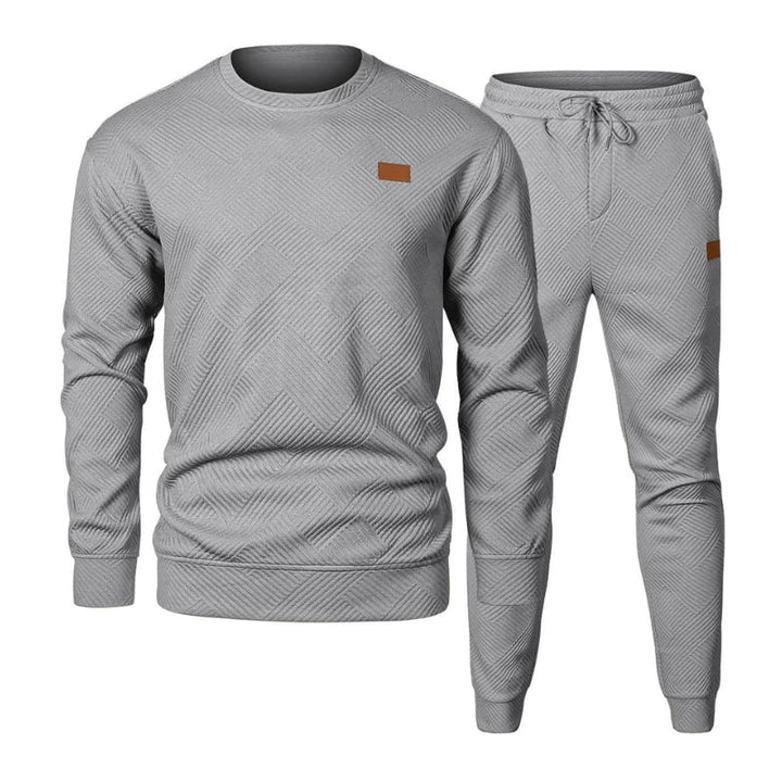 Men's casual grey 2-piece crew neck tracksuit set. Comfortable, versatile, and ideal for everyday wear.