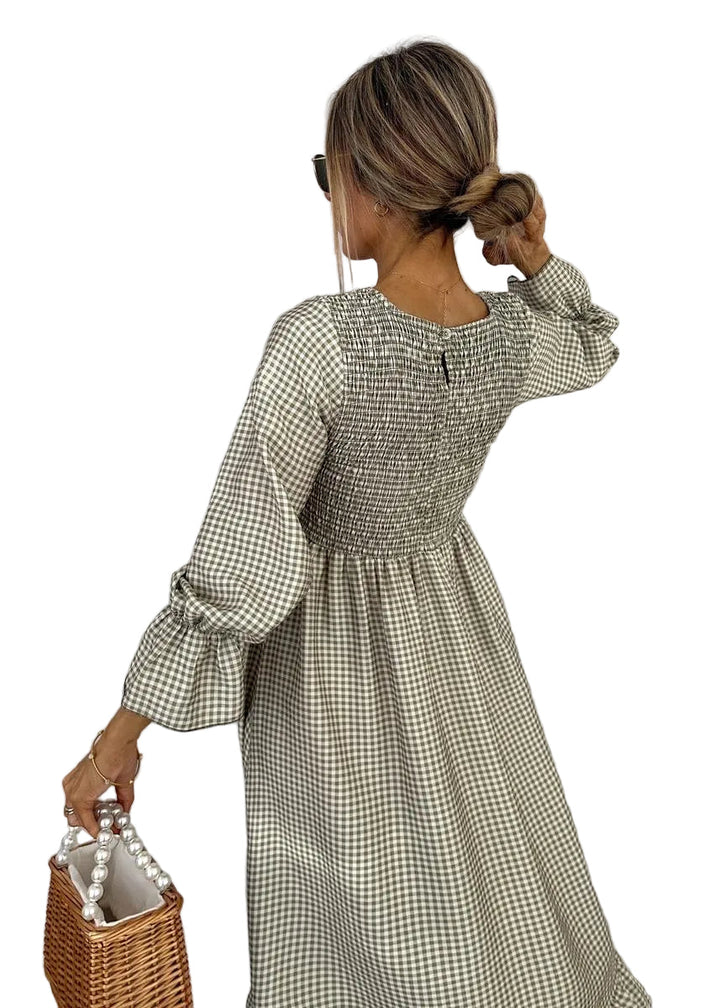 Women's long sleeve gingham check pattern maxi dress, featuring a flattering smocked bodice and A-line skirt.