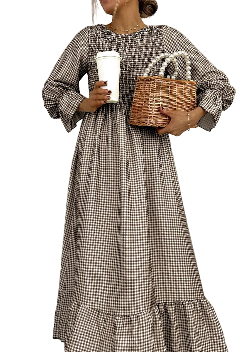 Elegant women's smocked maxi dress in classic gingham check, a versatile long sleeve A-line casual dress.