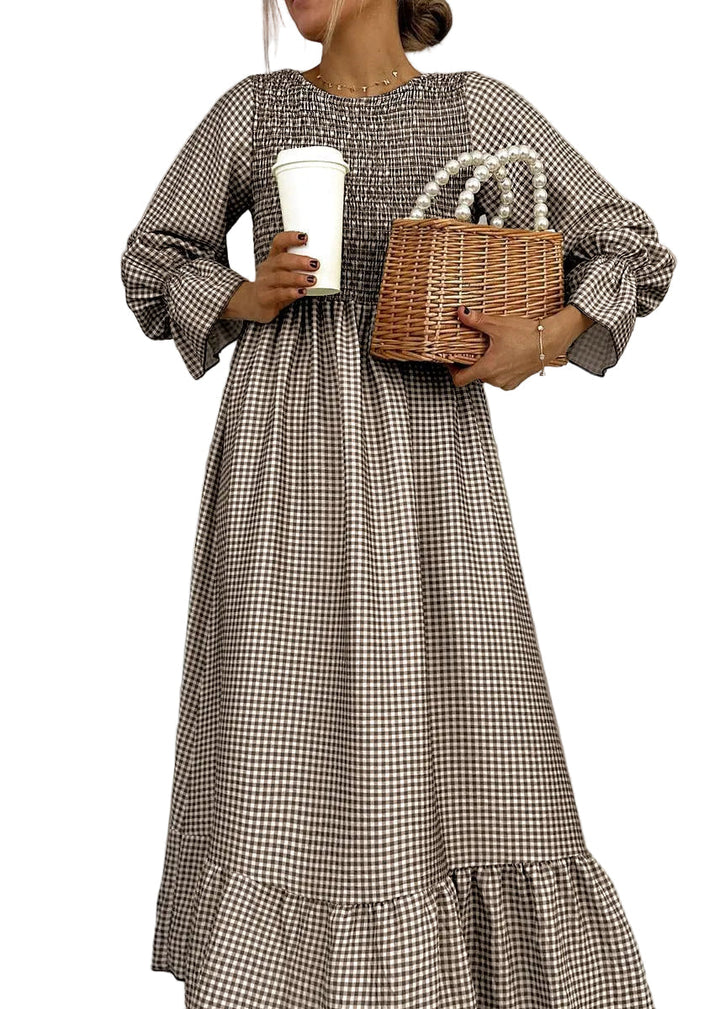 Elegant women's smocked maxi dress in classic gingham check, a versatile long sleeve A-line casual dress.