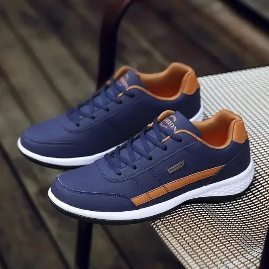 Casual men's blue orthopedic sneakers, cushioned for relaxed walking comfort.
