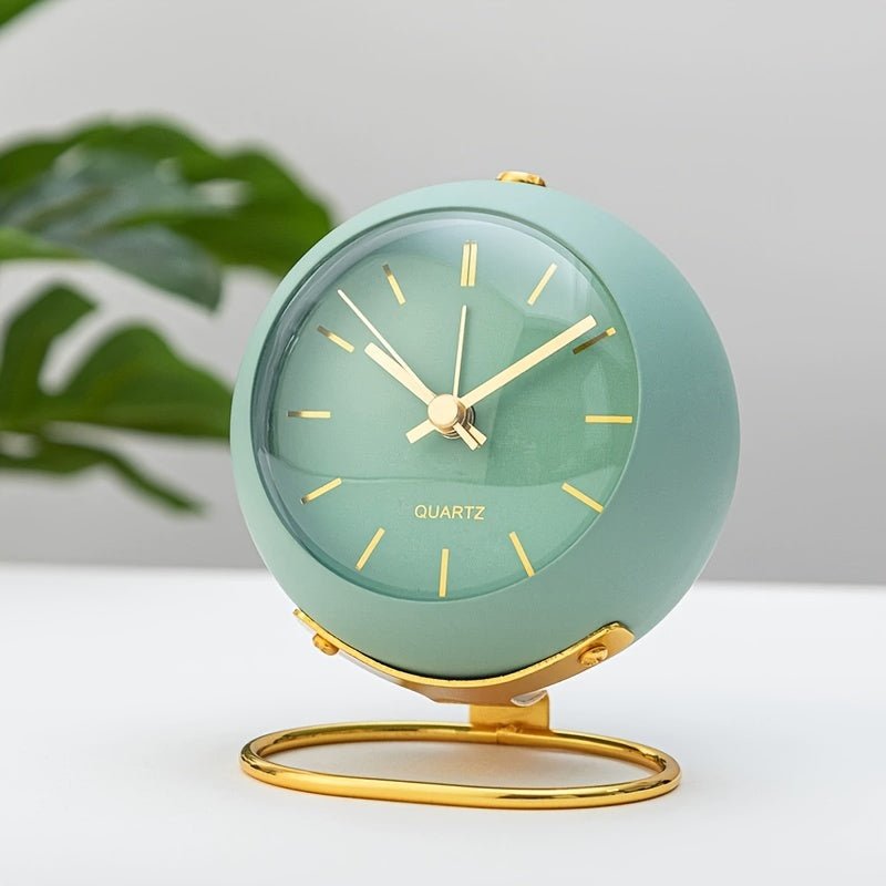 Retro metal alarm clock featuring a loud classic bell, silent movement, and a built-in night light. Perfect for travel.