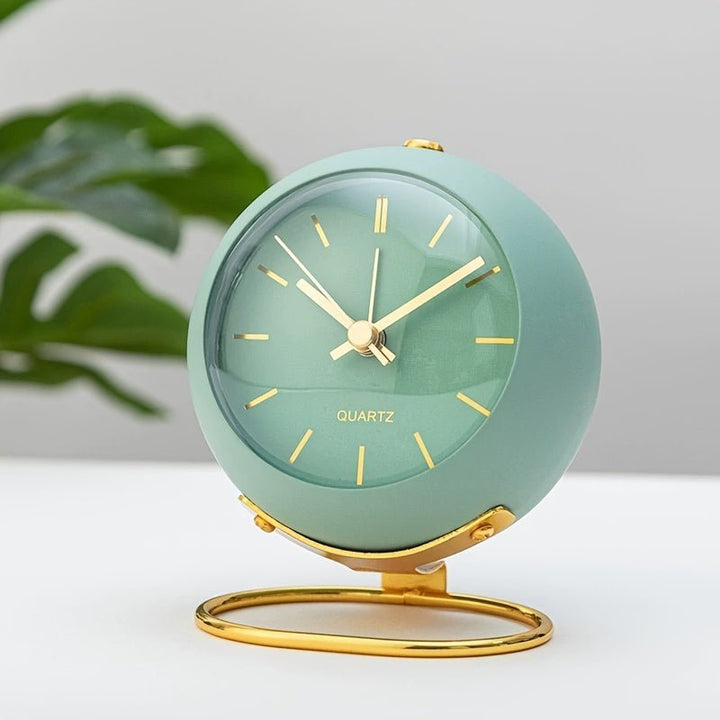 Retro metal alarm clock featuring a loud classic bell, silent movement, and a built-in night light. Perfect for travel.