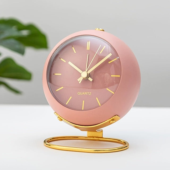 Classic vintage analog alarm clock in metal, ideal for bedroom or desk decor. Features silent operation & loud alarm.