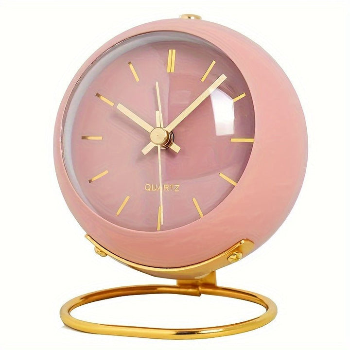 Compact vintage analog travel alarm clock with silent operation, loud bell, and convenient night light for journeys.