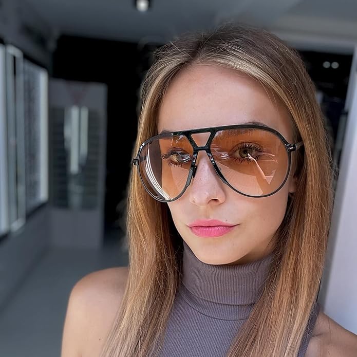 Chic women's retro aviator sunglasses, oversized design, vintage 70s fashion accessory.