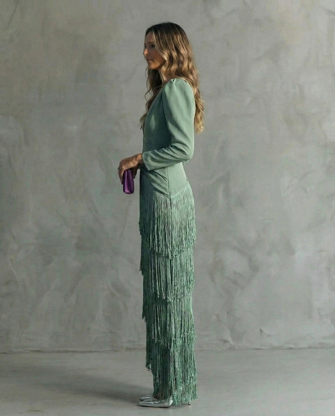 Stunning women's formal midi dress featuring elegant fringe, for a sophisticated party or evening look.
