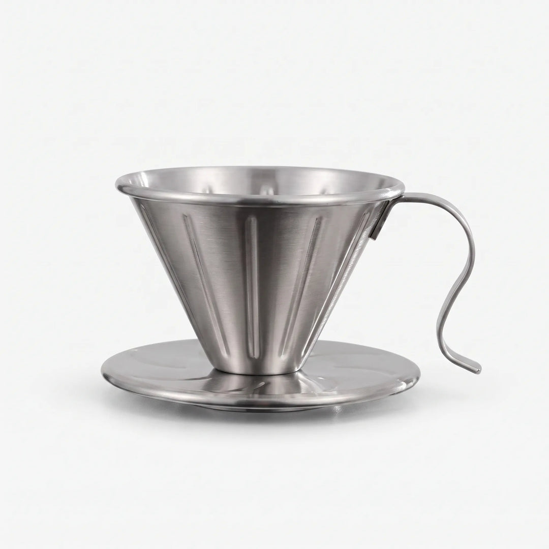 Stainless steel ribbed pour-over coffee dripper for perfect home brewing.