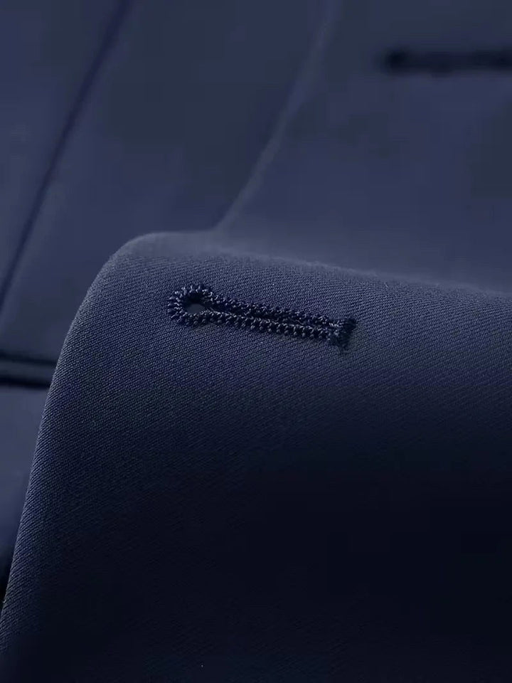 Close-up of men's slim fit suit fabric. High-quality material for a three-piece formal outfit.