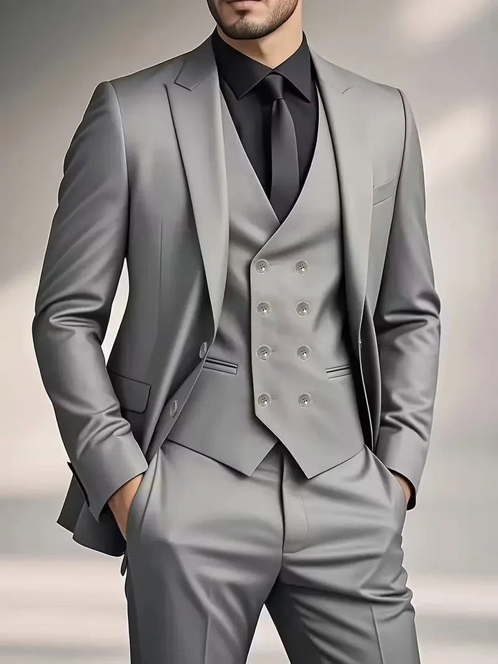 Full-length shot of a men's slim fit three-piece formal suit. Tailored for weddings and business.