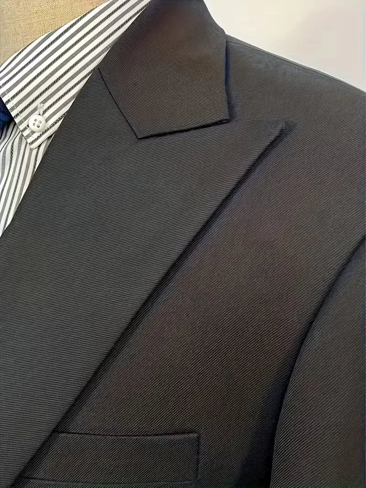 Elegant men's three-piece formal wear. Slim fit tailored suit with a double-breasted waistcoat.