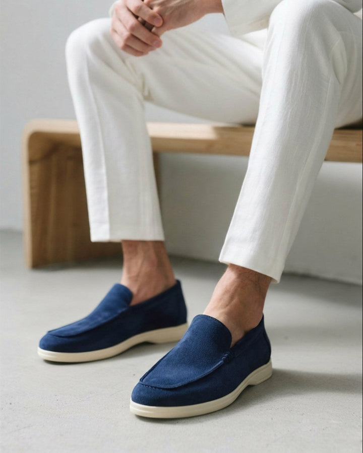 Side view of sleek black men's slip-on loafers, showcasing smart casual footwear design.