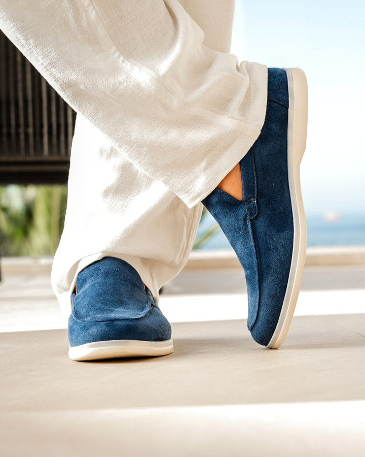 Top down view of comfortable blue men's slip-on loafers, ready for casual or smart outfits.