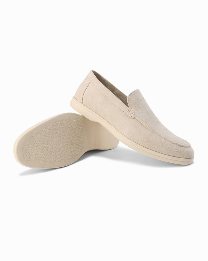 Single grey men's slip-on loafer, emphasizing comfort and smart casual footwear design.