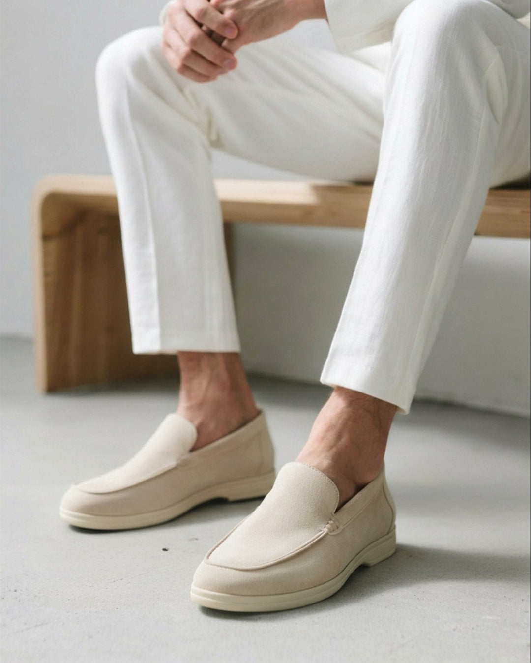 Men's slip-on loafers in brown, styled casually with jeans for a comfortable smart look.