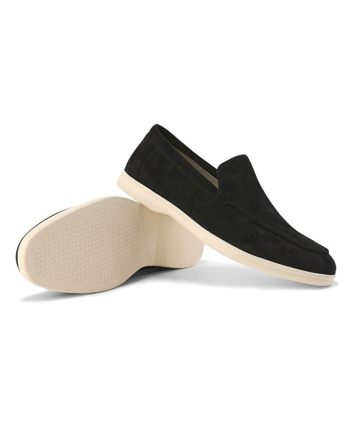 Classic black men's loafers, perfect slip-on shoes for a sharp smart casual outfit.