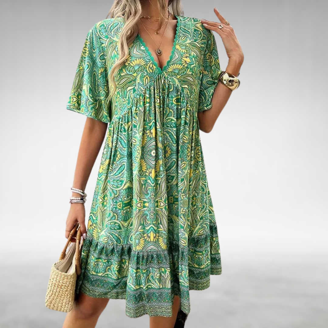 Women's effortless boho swing beach dress with vibrant paisley print and flattering V-neck. Perfect for summer vacations.