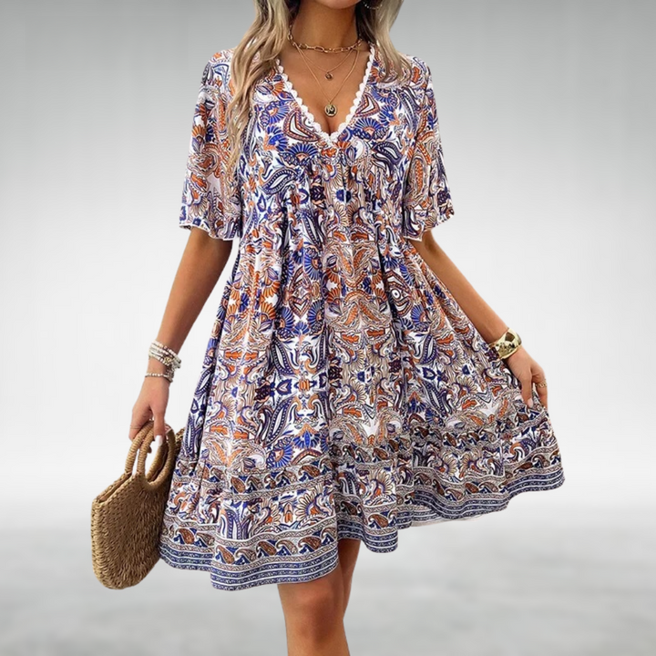 Casual women's relaxed fit summer beach dress, boho style, great for holidays. Features a comfortable swing design.