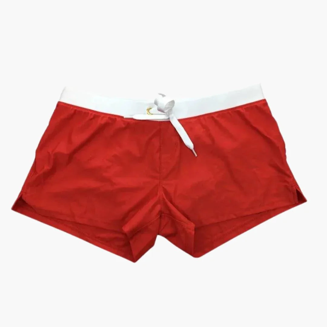 Men's quick-dry swim shorts with a stylish contrast waistband, perfect for beach or pool.