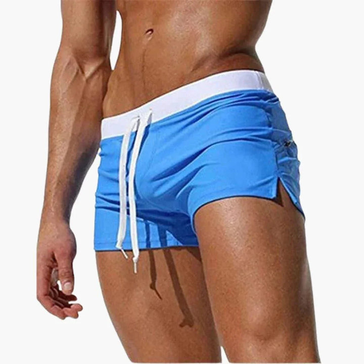 Modern men's quick-dry swimming shorts with a sleek contrast waistband, suitable for any water sport.