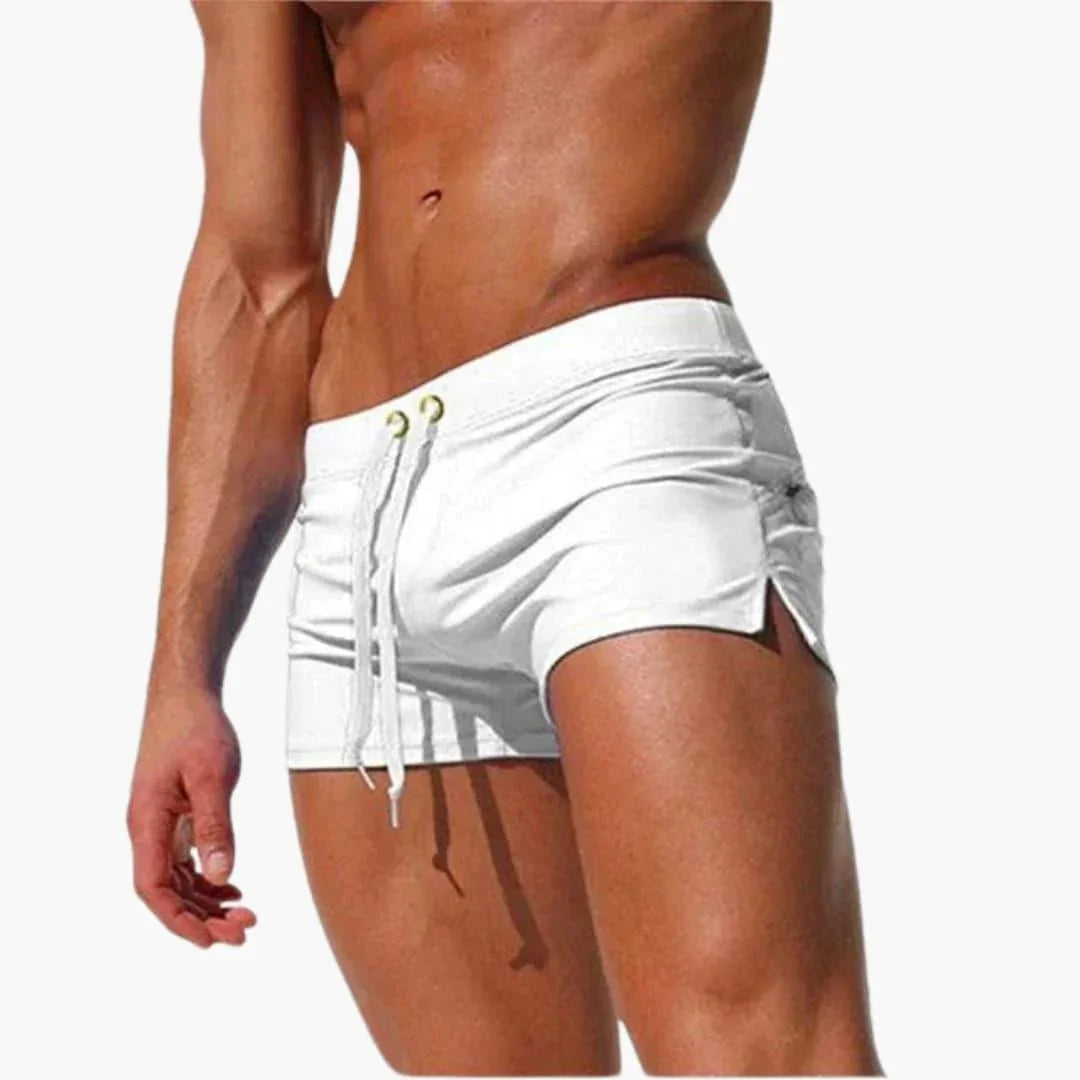 Blue men's quick-dry swimming shorts featuring a bold contrast waistband for summer fashion.