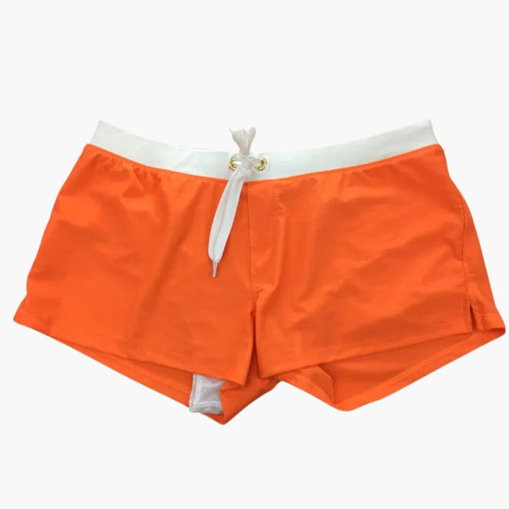 Athletic men's swim shorts, quick-dry fabric, and a trendy contrast waistband for beachwear.