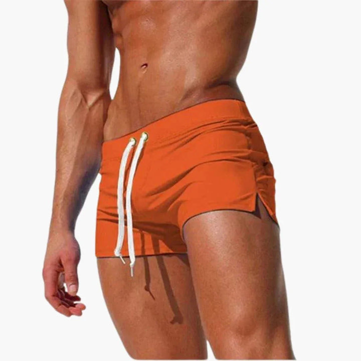 Casual men's board shorts with quick-dry comfort and a distinctive contrast waistband design.