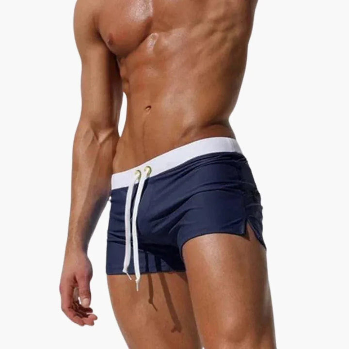 Quick-dry men's swimming shorts, ideal for pool activities, with an eye-catching contrast waistband.