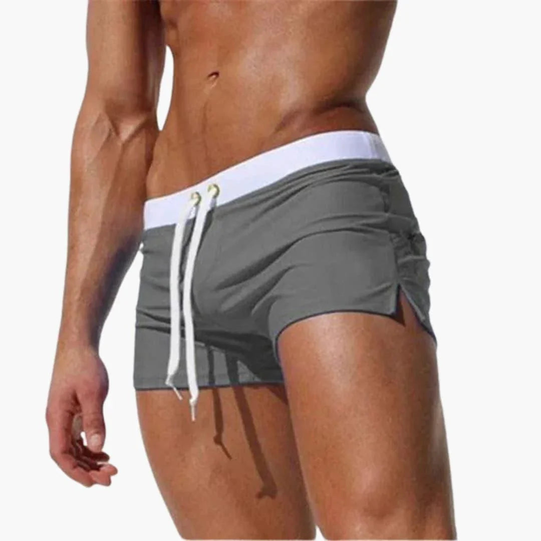 Comfortable men's quick-dry swim shorts, great for summer, with a sharp contrast waistband.