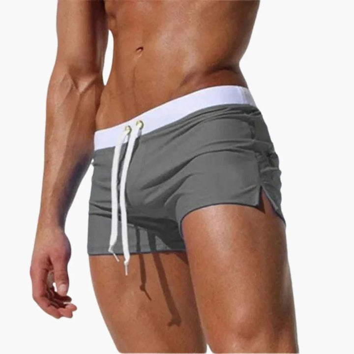 Comfortable men's quick-dry swim shorts, great for summer, with a sharp contrast waistband.