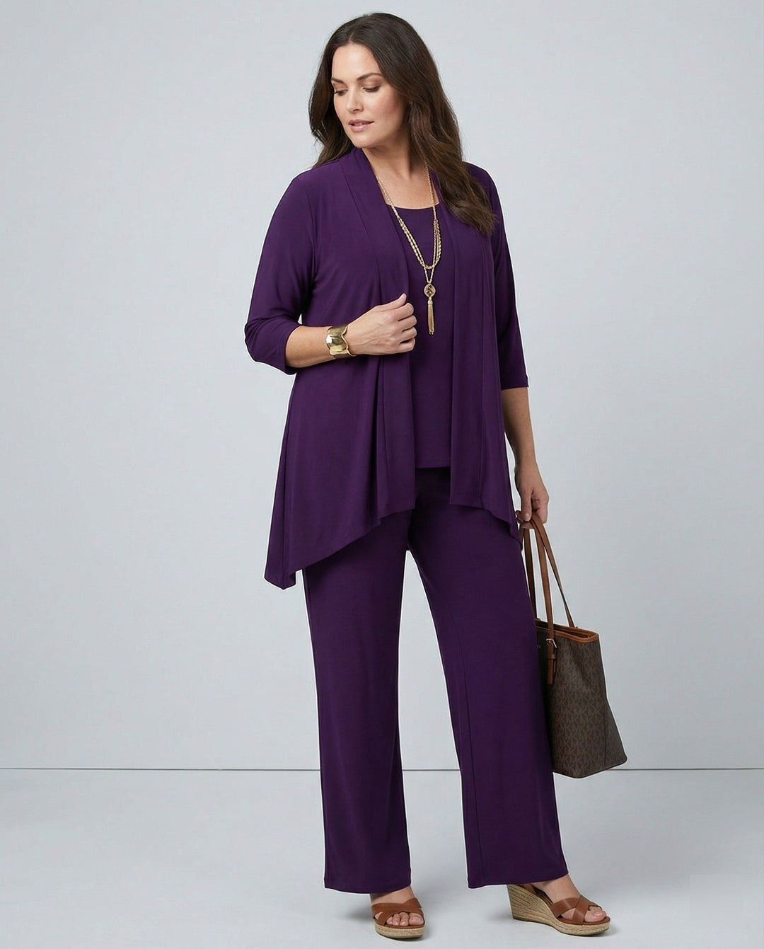 Women's 3-piece pant suit set with wide leg pants, jacket, and sleeveless top for elegant professional wear.